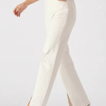 White pants worn by a person on a white background