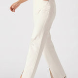 White pants worn by a person on a white background