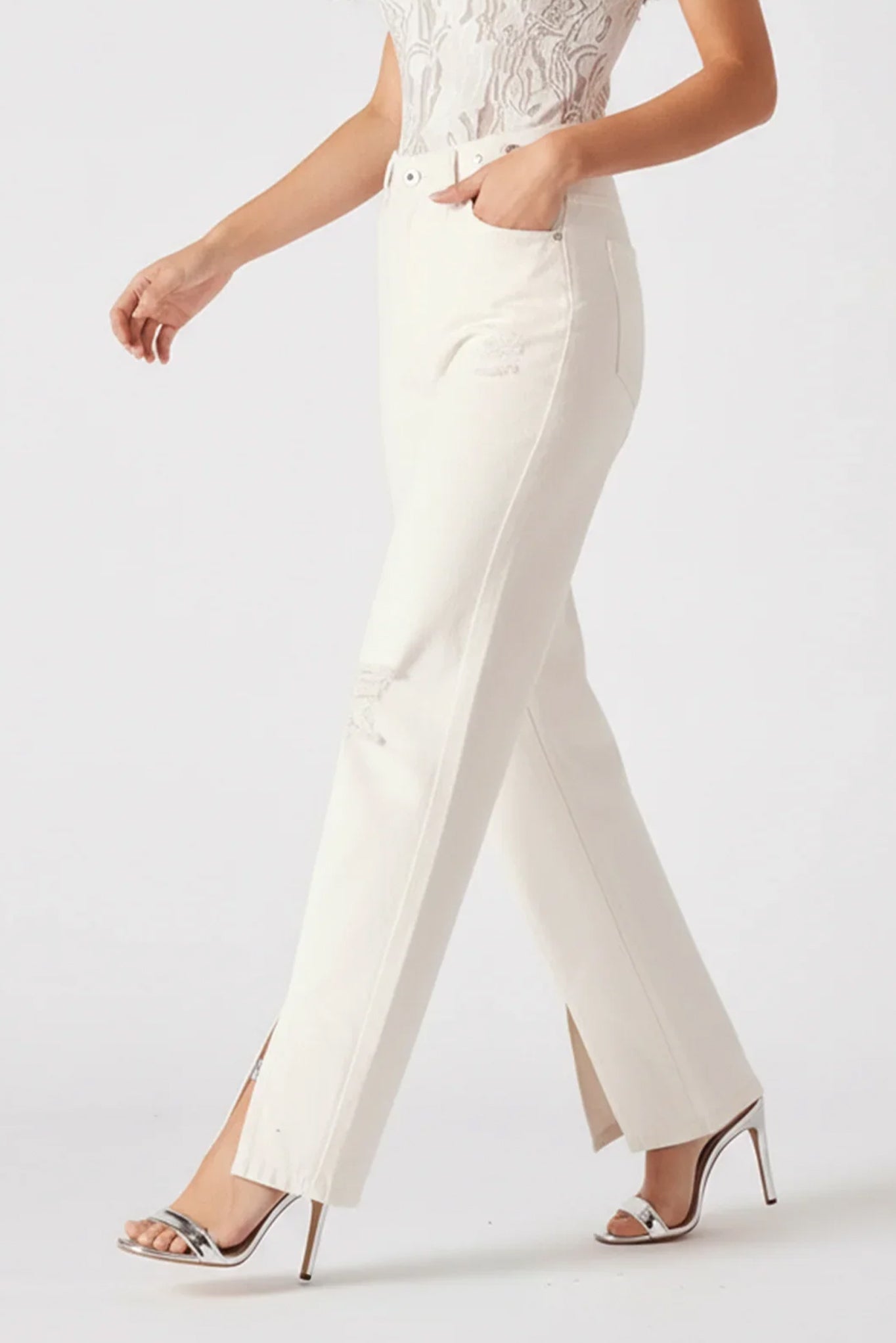 White pants worn by a person on a white background