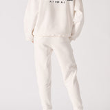 Rear view of a white sweatshirt for women showing the large black branding