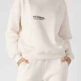 Front view close up of a white sweatshirt for women showing the logo