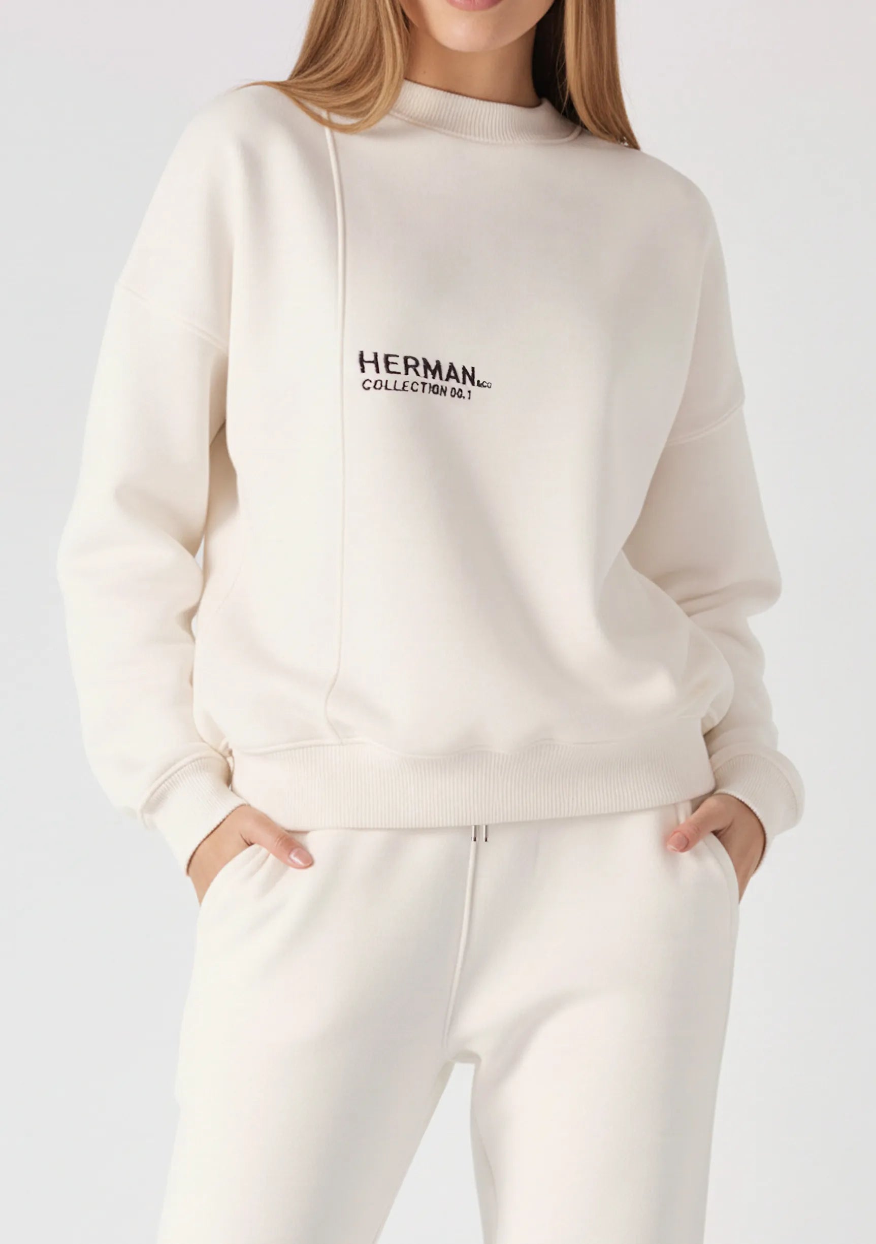 Front view close up of a white sweatshirt for women showing the logo