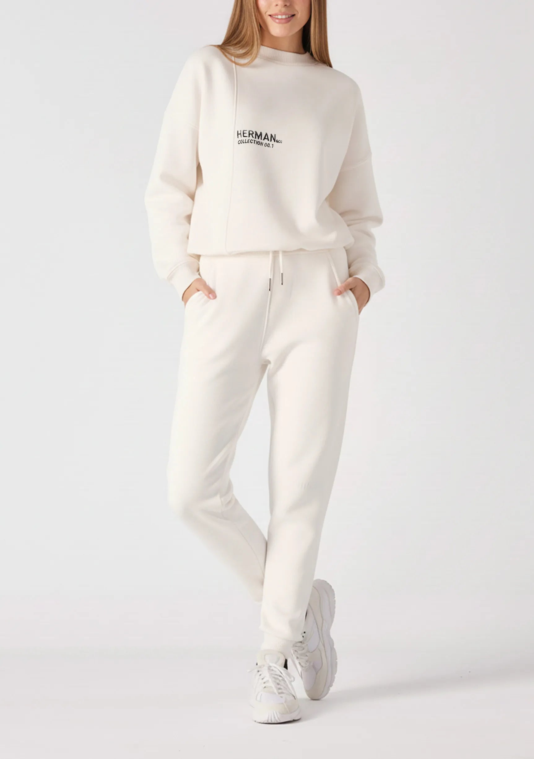 A woman posing in a white sweatshirt for women with a casual fit