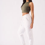 Side profile of a model wearing a comfortable white tapered jogger womens.