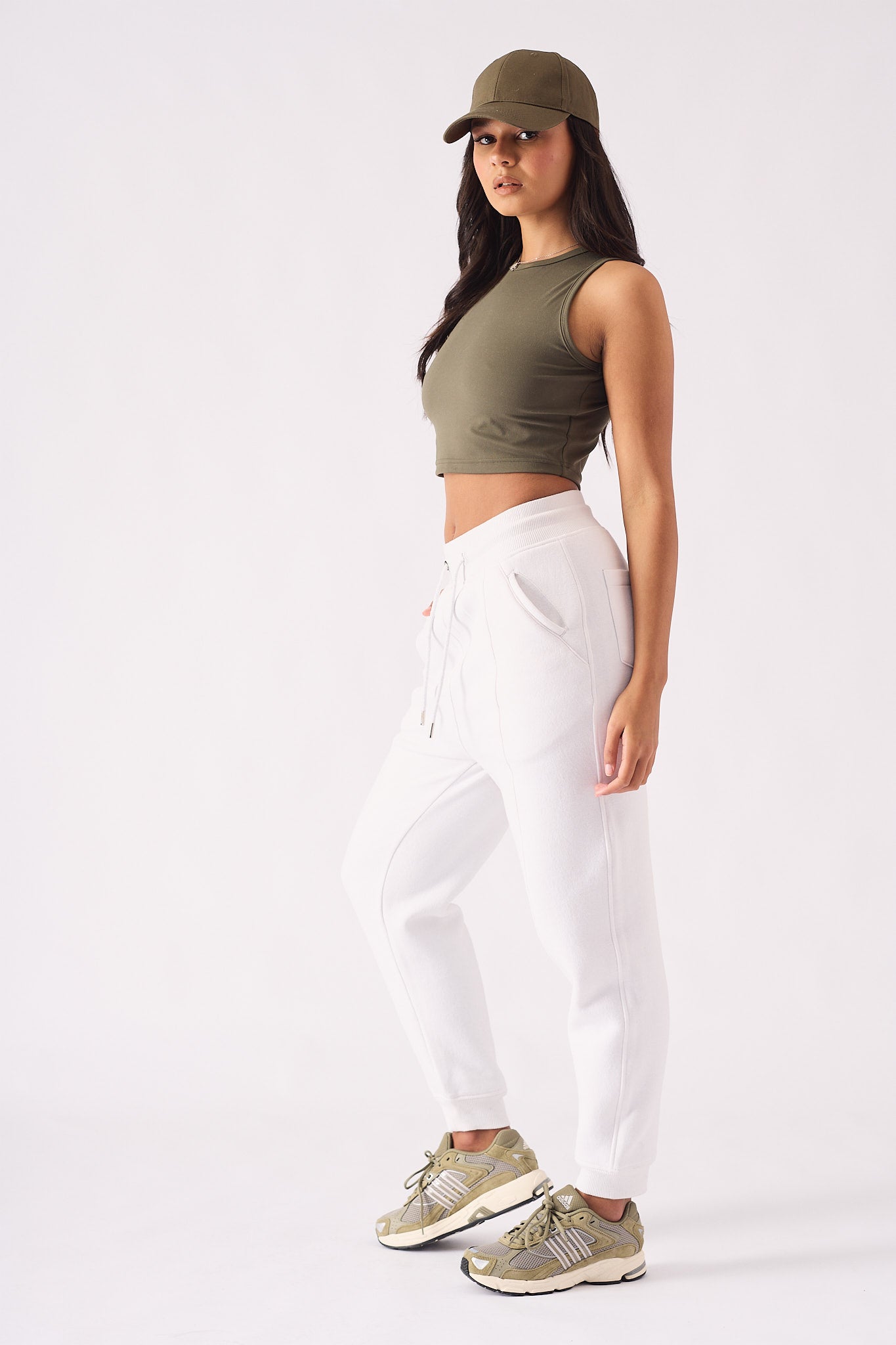 Side profile of a model wearing a comfortable white tapered jogger womens.