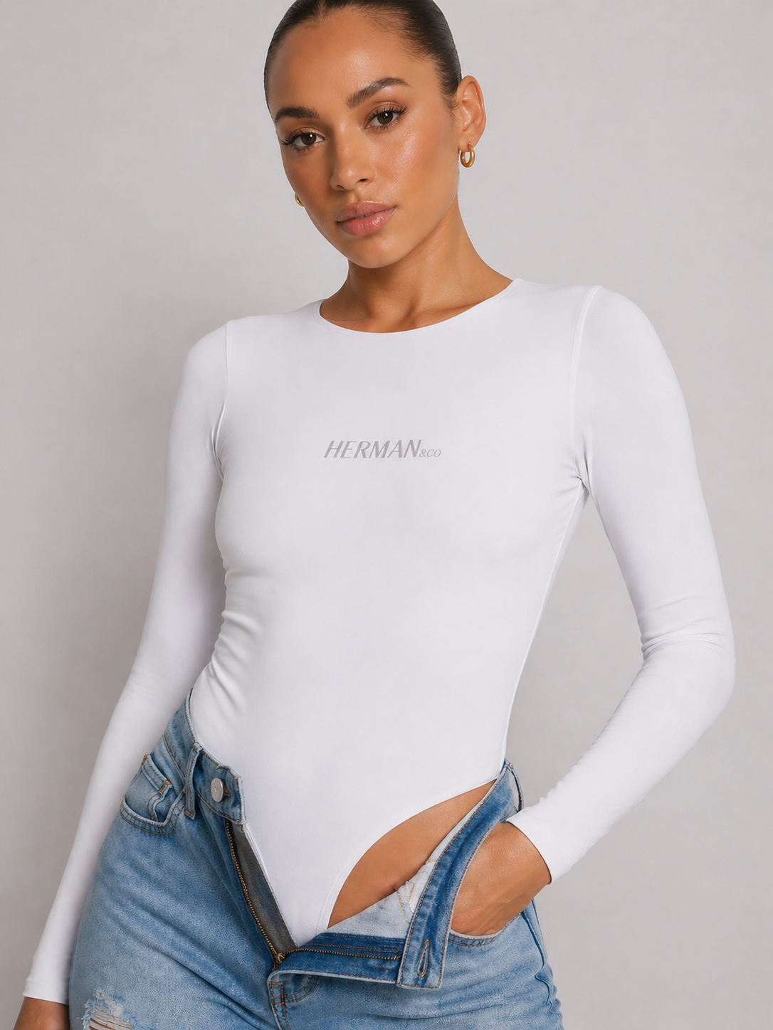 White thumbhole shaping bodysuit front fit detail