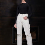 Front view of a model wearing the women's off-white distressed jeans.