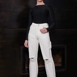 Front view of a model wearing the women's off-white distressed jeans.