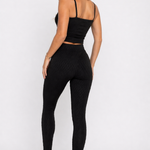 A woman wearing womens-black-bubble-texture-leggings back view showing the raised bubble texture and high waist fit