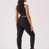 Rear full body shot showing the fit of womens black jogger