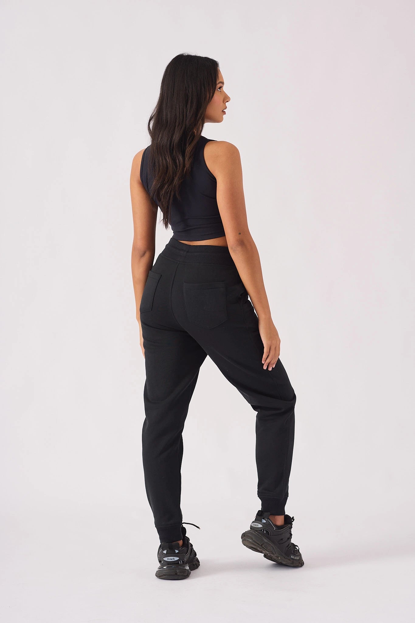 Rear full body shot showing the fit of womens black jogger