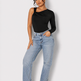 A woman standing full length wearing a Women's Black One Shoulder Ruched Bodysuit with blue jeans and black heels