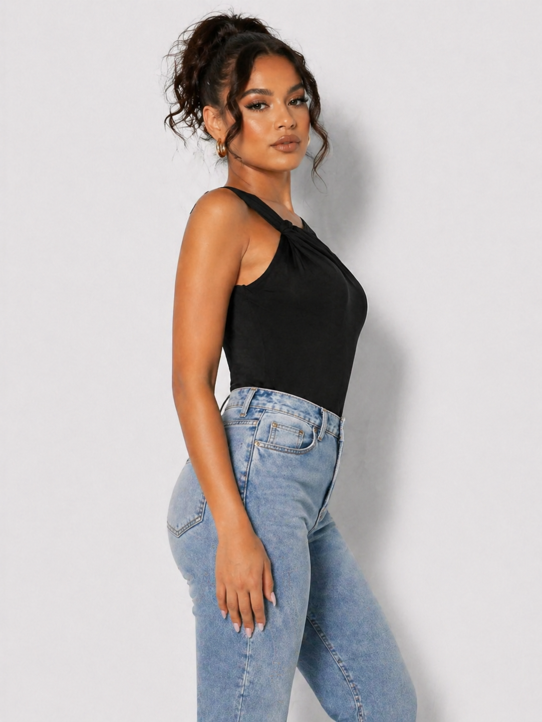 Side view showing sleeveless bare shoulder of a Women's Black One Shoulder Ruched Going Out Bodysuit