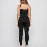 Full length back view of a woman in Women's Black Ribbed High Waist Leggings with matching co-ord top