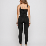 Full length back view of a woman in Women's Black Ribbed High Waist Leggings with matching co-ord top