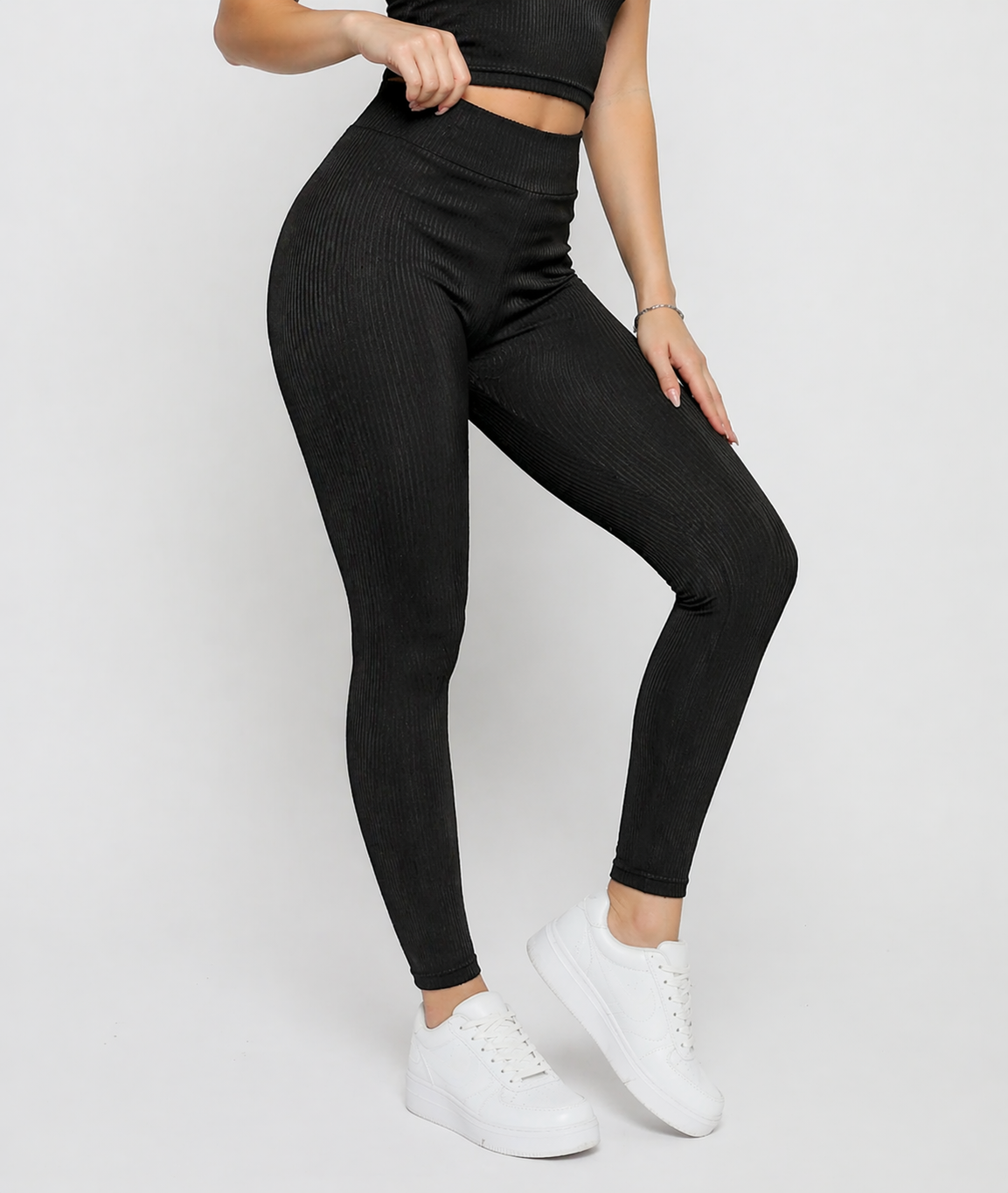 Close up view of Women's Black Ribbed High Waist Leggings showing elasticated waistband and pintuck stripe detail