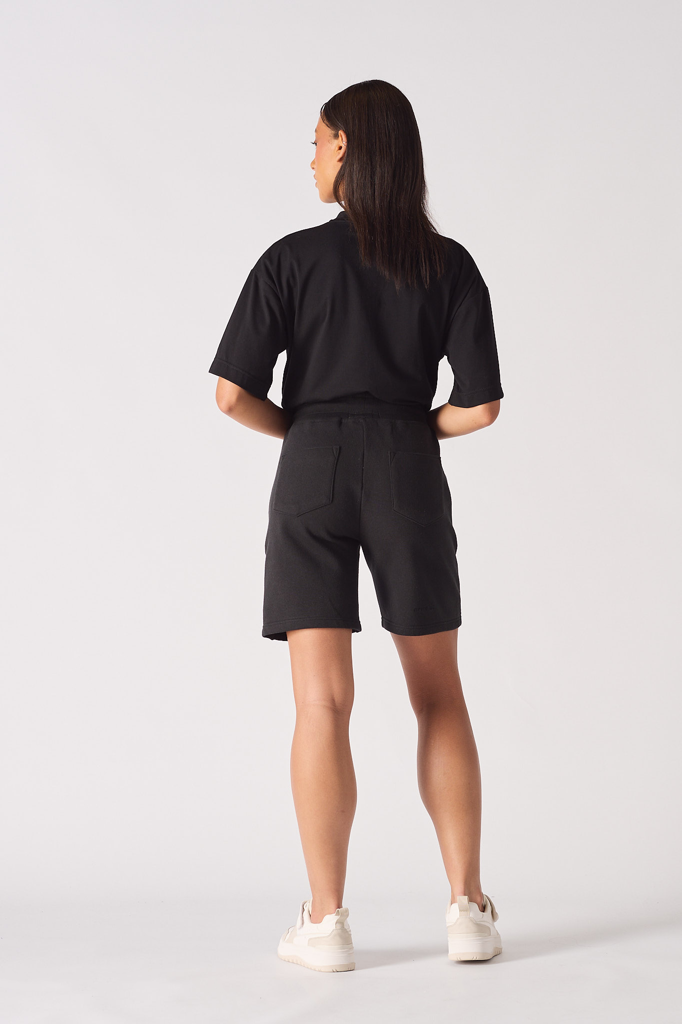 womens black sweat shorts back view showing patch pockets