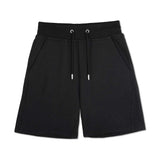 womens black relaxed sweat shorts flat lay front