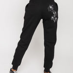 Back view of the women's black tapered joggers with white floral embroidery