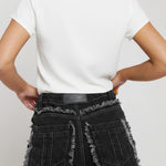 Close up of back pocket and frayed seam on Womens Black Wash jeans