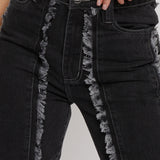 Close up of silver popper hem detail on Womens Black Wash jeans