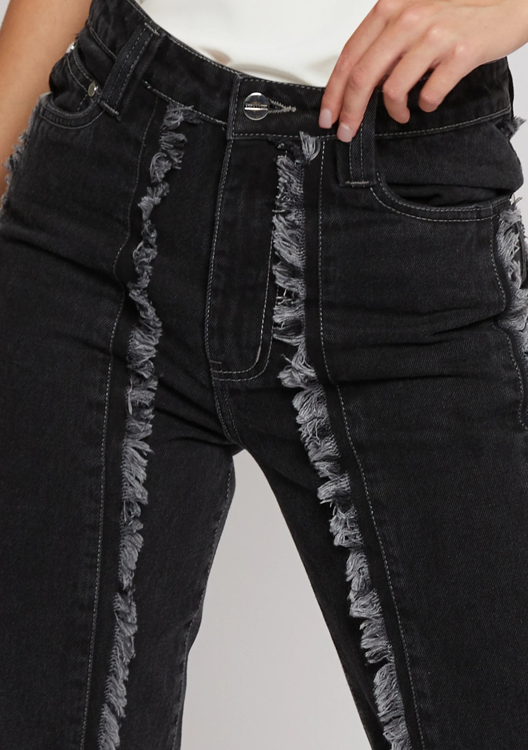 Close up of silver popper hem detail on Womens Black Wash jeans
