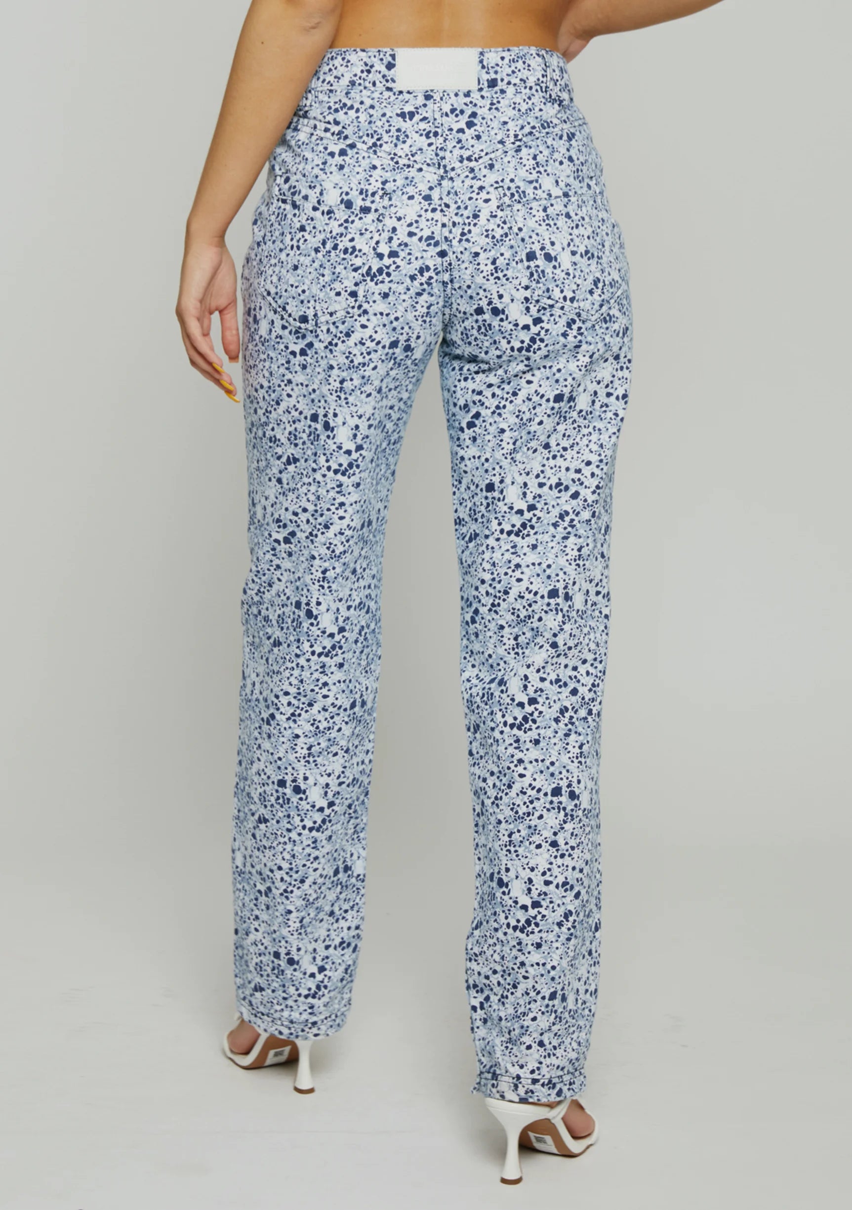 Back pockets and vegan leather patch on Womens Blue Marble jeans