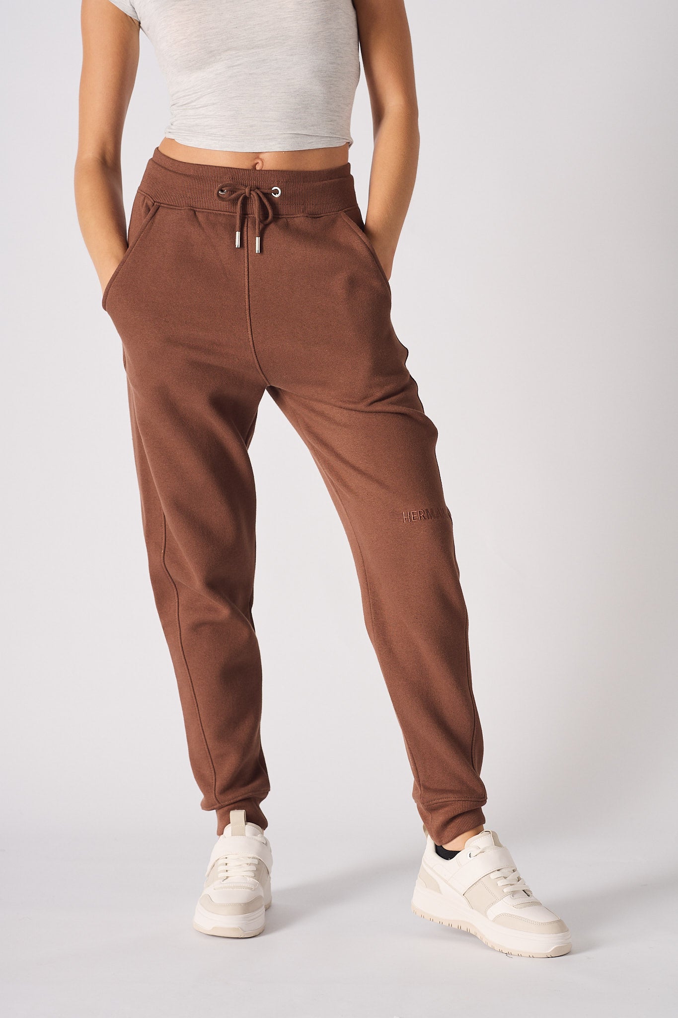 front view showing pockets on brown tapered joggers