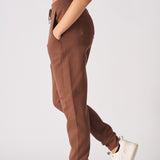 side profile of woman in brown tapered joggers