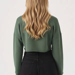 Back view showing the comfortable fit of the womens cropped green jumper.