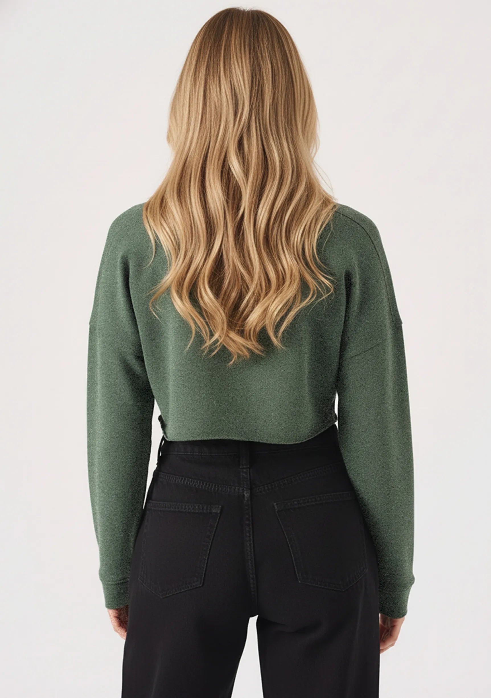 Back view showing the comfortable fit of the womens cropped green jumper.