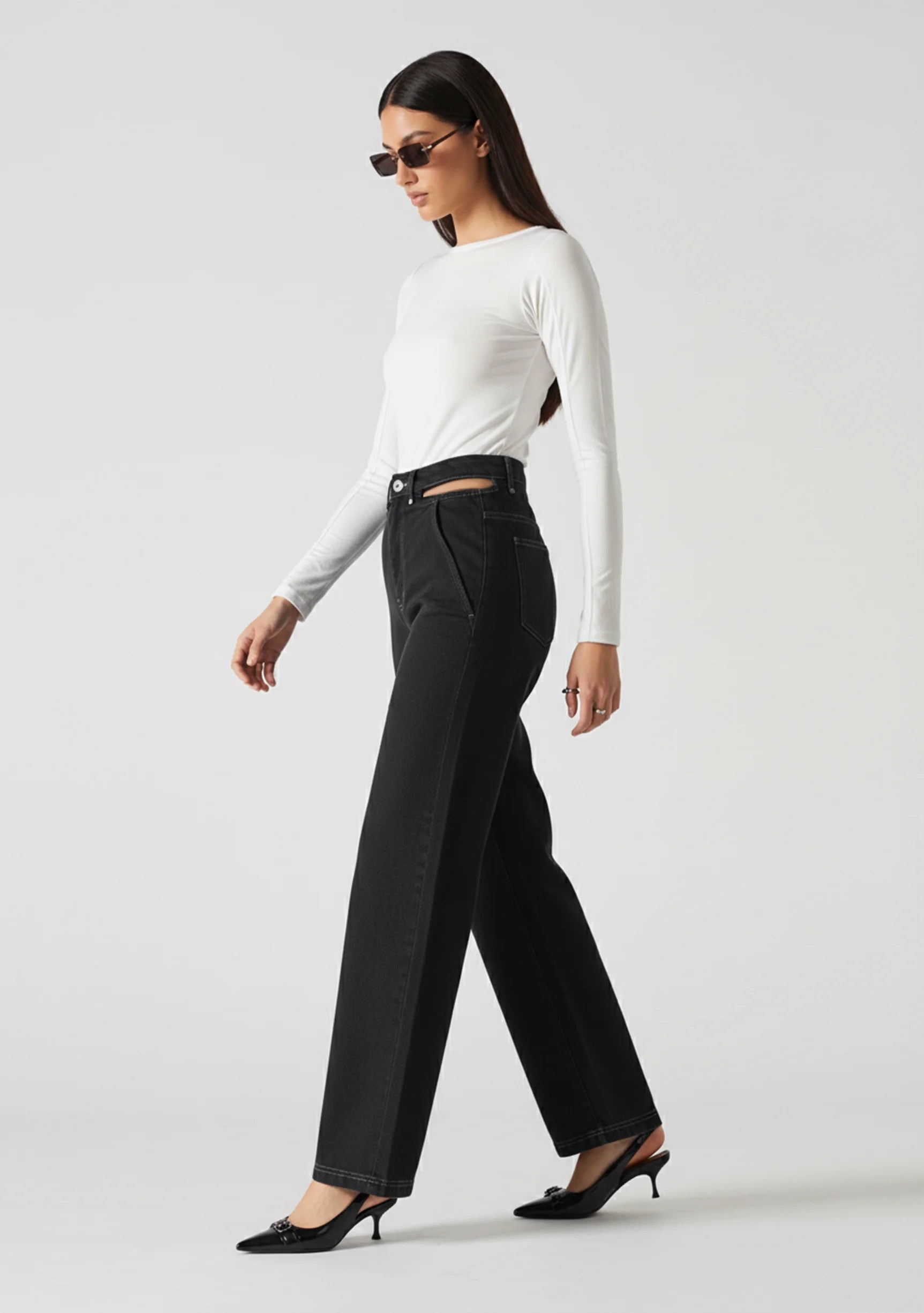 Womens cut out straight leg jeans side walking pose