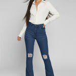 Womens dark blue distressed flare jeans dynamic front view