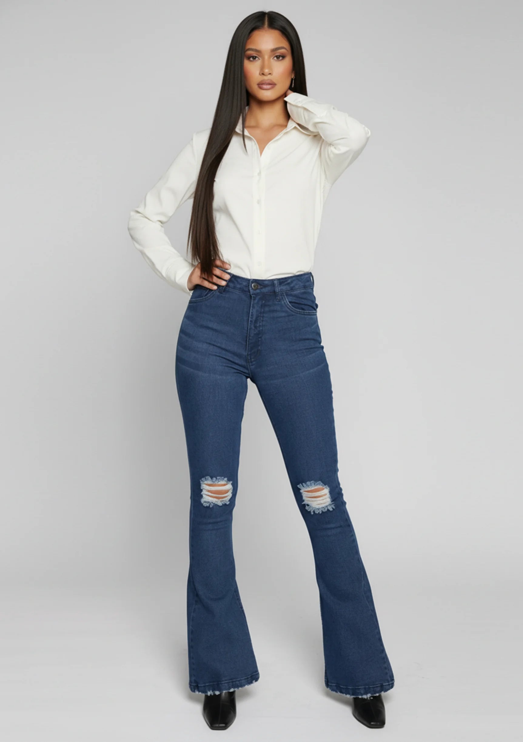Womens dark blue distressed flare jeans front view