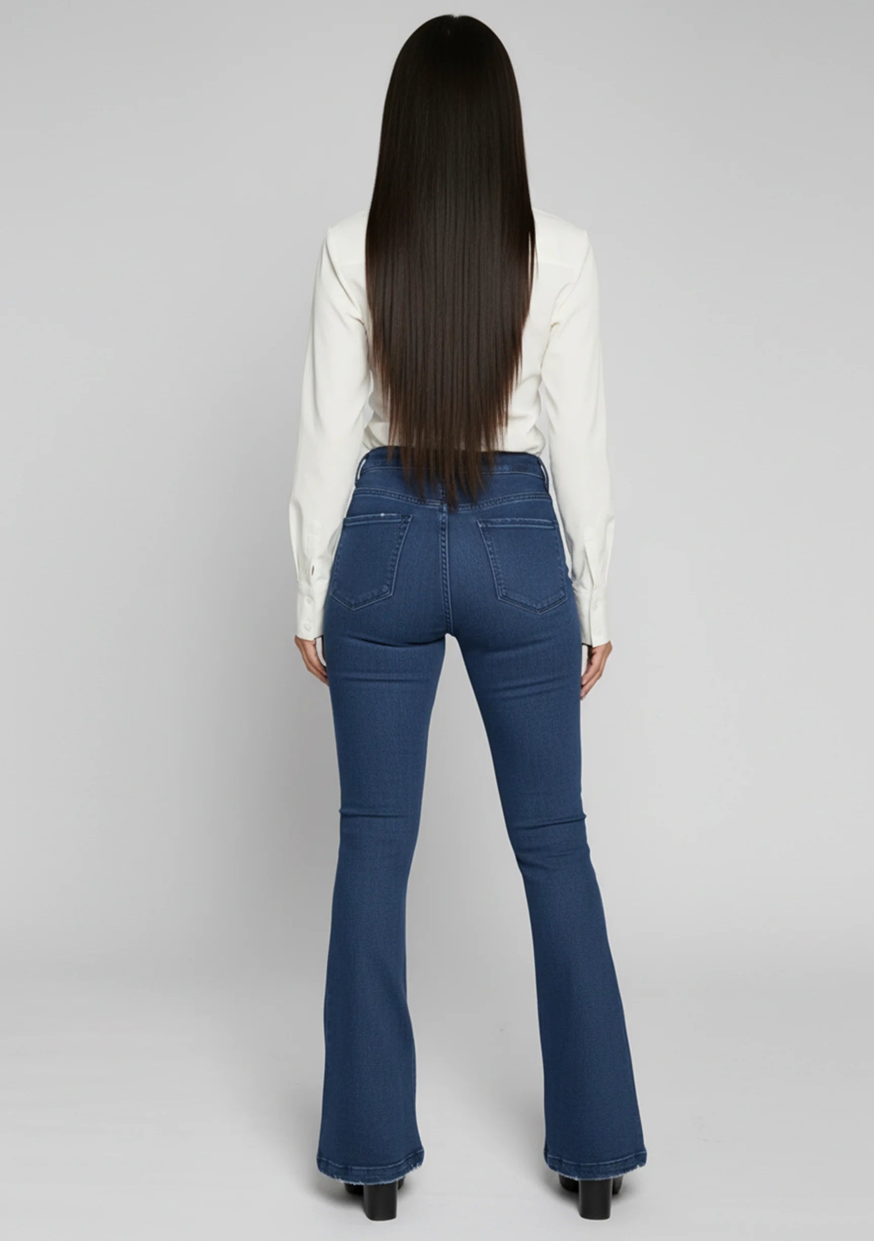 Womens dark blue flare jeans back view with pocket details