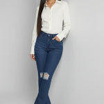Womens dark blue frayed hem flare jeans leaning pose