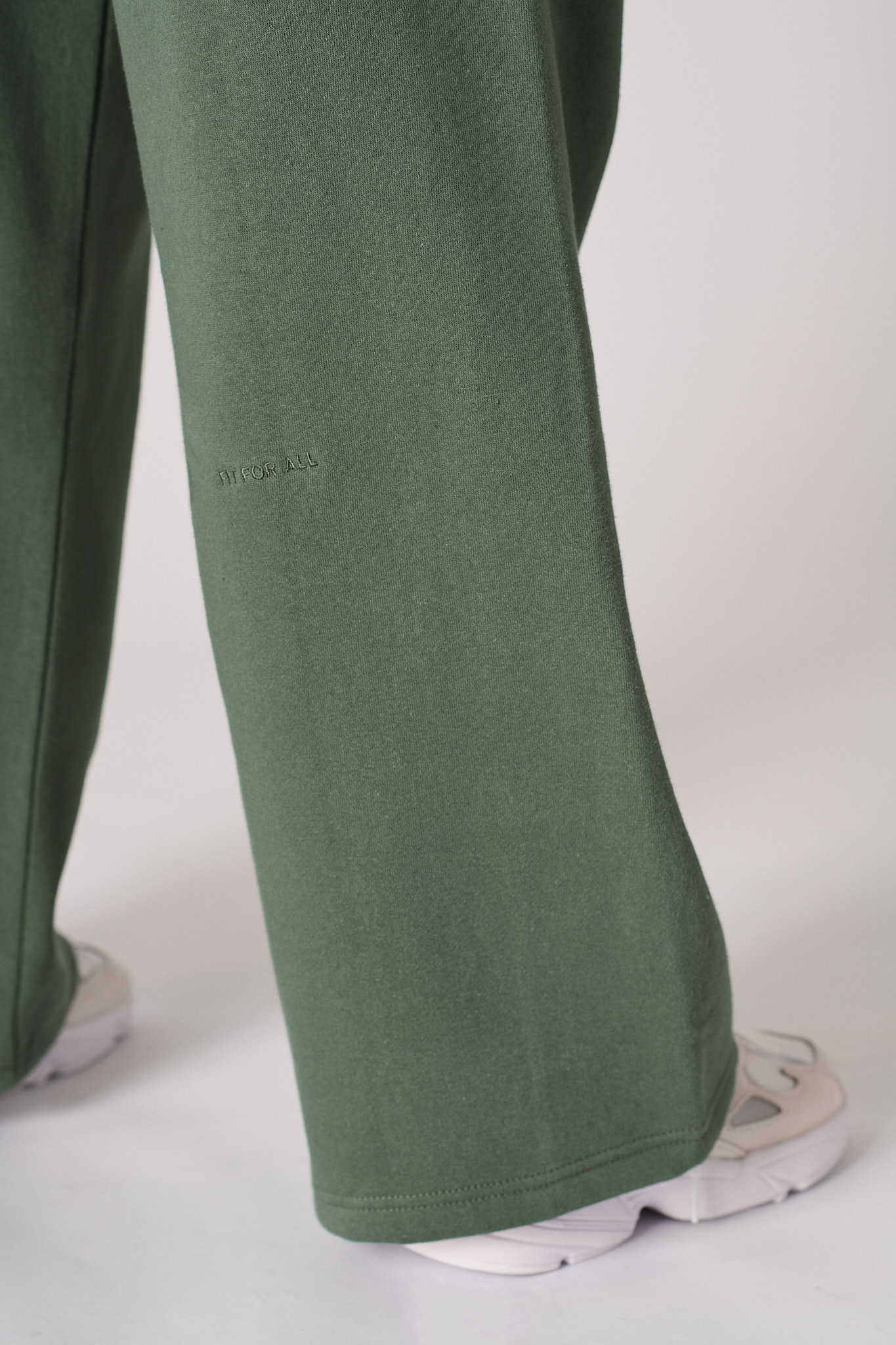Womens dark green wide leg joggers back flat lay