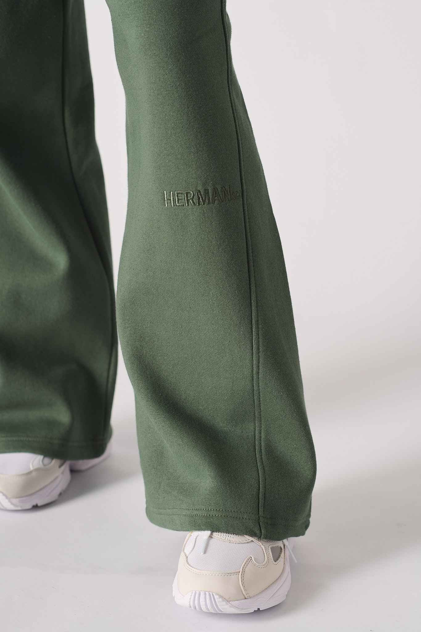 Womens dark green wide leg joggers front flat lay