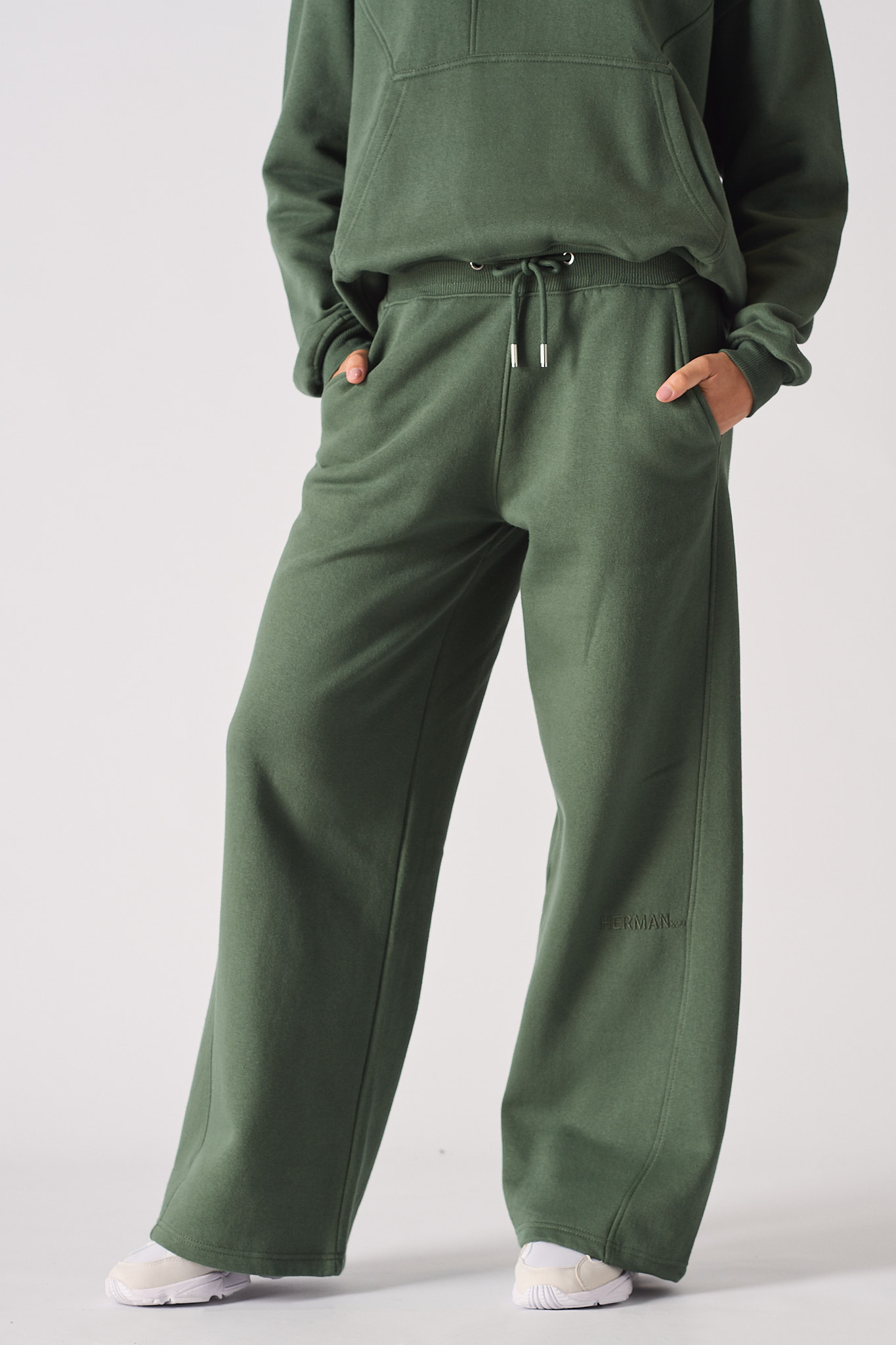 Womens dark green wide leg joggers front view