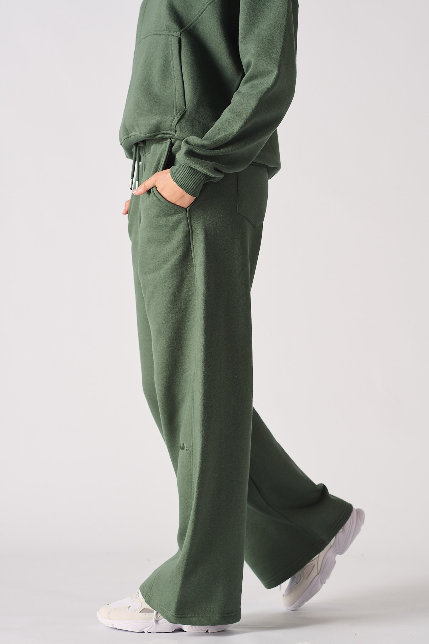Womens dark green wide leg joggers side profile