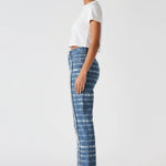 Side profile view of a model in Women's Distressed Edge Blue White Jeans