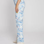 Side profile view of women's fluid print straight fit pants showcasing the unique light blue swirl pattern.
