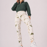 A woman in womens-green-stone-print-high-waist-leggings standing in an active pose showing the print detail and full length fit