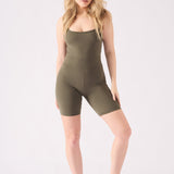 Full length front view of a model in a slim fit green unitard for women