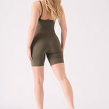 Back view of a woman in a green unitard showing the functional cycling short length