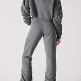 Rear view of a charcoal grey crew neck jumper showing the relaxed fit and back silhouette