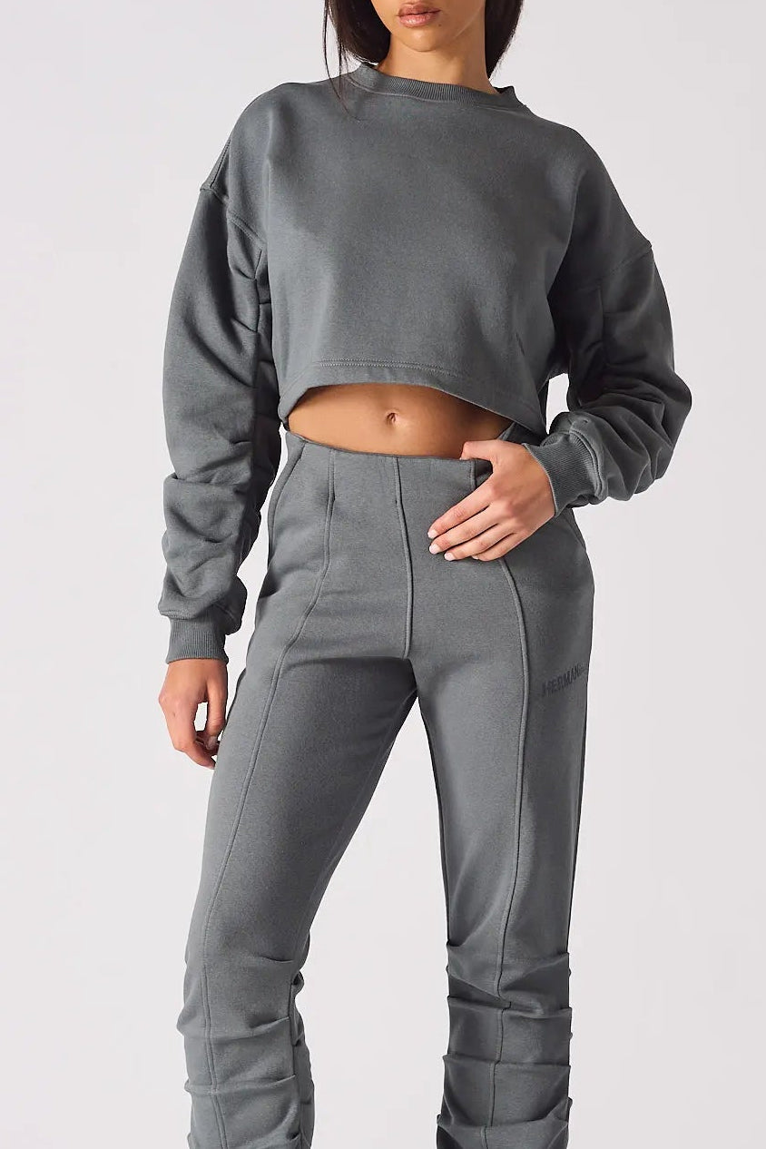 Front view of a charcoal grey cropped jumper for women with a simple crew neck
