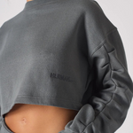 Side view close up showing the artfully sculpted ruched sleeve design