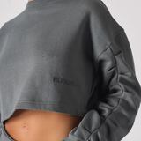 Side view close up showing the artfully sculpted ruched sleeve design