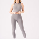 Full front view of a grey crop top for women with a high neck design